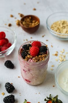 there are berries and granola in the glass jar