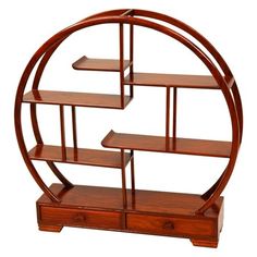 a wooden shelf with three shelves in the shape of a circle on top of it