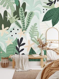 a bed room with a plant wallpaper and a wooden table in front of it