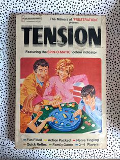 a magazine cover with an image of two people playing a game on the table together