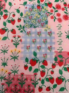 an image of a patchwork quilt with strawberries and flowers