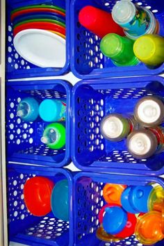 a blue container filled with lots of different colored cups