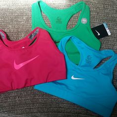 Nwt 3 Nike Dri Fit Bras Xs. Green One Still Has Tags. Blue And Pink Do Not But The Stitching For The Tag Is Still Attached As They Have Never Worn. (Realized I'm More A Size S) Pink Seamless Tops For Training, Nike Pink Racerback Sports Bra, Pink Sports Tops With Built-in Bra, Pink Sports Top With Built-in Bra, Pink Bra Friendly Top For Training, Pink Bra-friendly Top For Training, Nike Pink Activewear For Loungewear, Nike Seamless Tops With Medium Support, Nike Pink Training Tops