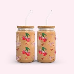 two mason jars with straws on the lids