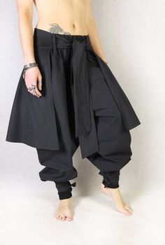 Check out this item in my Etsy shop https://www.etsy.com/listing/1277824089/hakama-pants-v11-black-cotton-unisex Casual Black Cotton Harem Pants, Black Cotton Harem Pants For Spring, Loosely Fitted High-waisted Cotton Parachute Pants, Black Cotton Pants For Spring, High Waist Cotton Parachute Pants For Fall, Black Stretch Cotton Pants, Black Cotton Harem Pants For Fall, Cotton Harem Pants For Fall, Solid Cotton Harem Pants For Fall