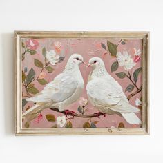 two white birds sitting on top of a pink flowered branch with leaves and flowers