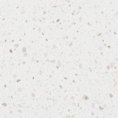 a white counter top with small speckles on it