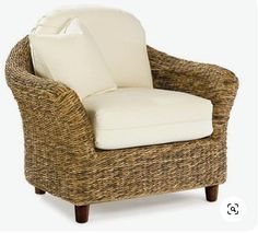 a wicker chair with a white cushion on top of it's back legs