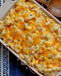 a casserole dish with macaroni and cheese in it on a table