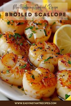 shrimp scallops on a plate with lemon wedges and parsley