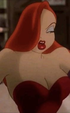 an animated image of a woman with red hair and blue eyes, wearing a bra