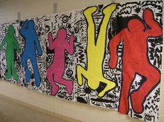 three colorful paintings hanging on the wall next to each other in an office building or school