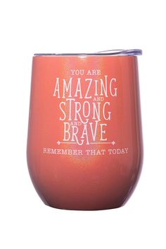 a red wine glass with the words, you are amazing and strong brave on it