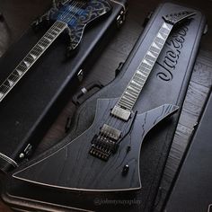 an electric guitar and case sitting on top of a table