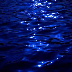 the blue water is reflecting light on it's surface