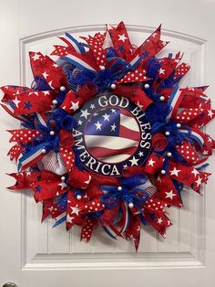 a wreath with the words god america on it and red white and blue stars around it