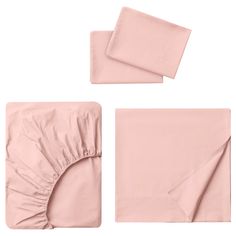 the pink sheets and pillow cases are folded up on top of each other, with two matching napkins