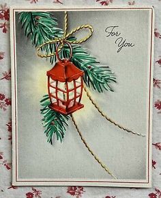 an old fashioned christmas card with a red lantern hanging from a pine tree branch and the words, for you