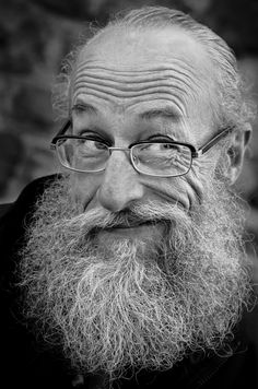 an old man with glasses and a beard