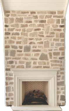 a stone fireplace with a white mantle and brickwork on the top part of it