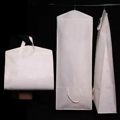 two white bags are next to each other on a black background and one is empty