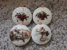 three christmas ornaments sitting on top of a carpet