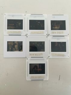 five polaroid frames mounted on the wall with writing