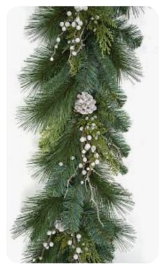 a christmas garland with pine cones and white berries