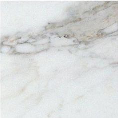 a white marble counter top with black and grey veining on it's edges