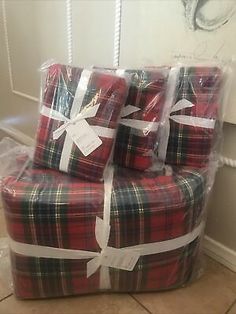 three wrapped presents sitting on top of each other