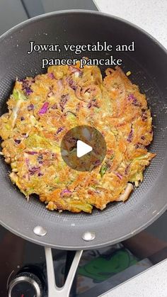 an omelet is being cooked in a pan on the stove with words that read jowar vegetable and panerapancake