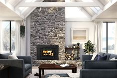 a living room filled with furniture and a fire place in the middle of a room