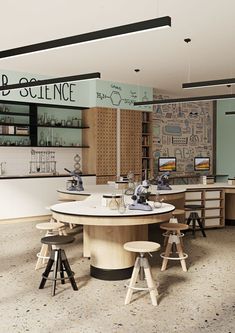 the interior of a science lab with stools and tables