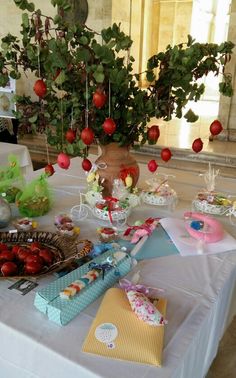 a table topped with lots of different types of food and decorations on top of it