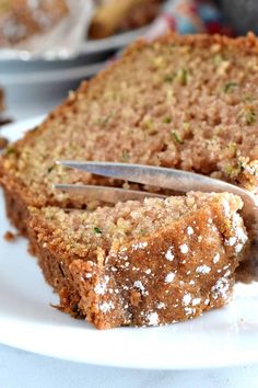 a piece of cake on a plate with a knife