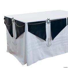 a white table with black and white cloth on it