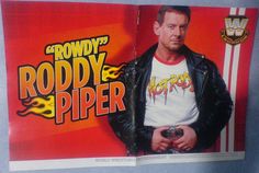 a man in a leather jacket standing next to a red and yellow advertisement for roddy piper