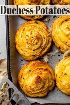 some food that is sitting on a baking sheet with utensils next to it