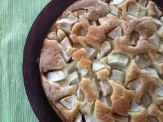 a pie that is sitting on top of a pan with some kind of toppings