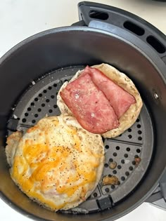 an omelet and some meat in a frying pan