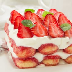 a cake with strawberries and cream on top