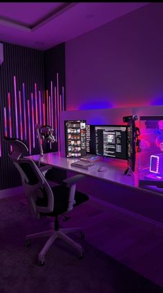 a computer desk with two monitors and a keyboard in front of purple lights on the wall