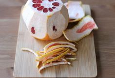 sliced up fruit sitting on top of a wooden cutting board