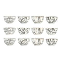 eight white bowls with designs on them are lined up against a white background, one is empty