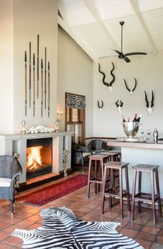 a living room filled with furniture and a fire place