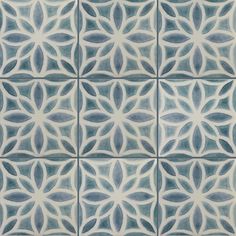 an artistic tile design in blue and white