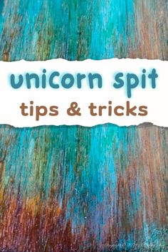 the words unicorn spit tips and tricks written in white paper on top of an abstract painting