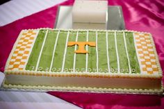 a football field cake with the number twenty on it and an orange letter in the middle