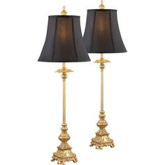 two lamps with black shades on them