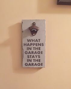 a sign on the wall that says what happens in the garage stays in the garage